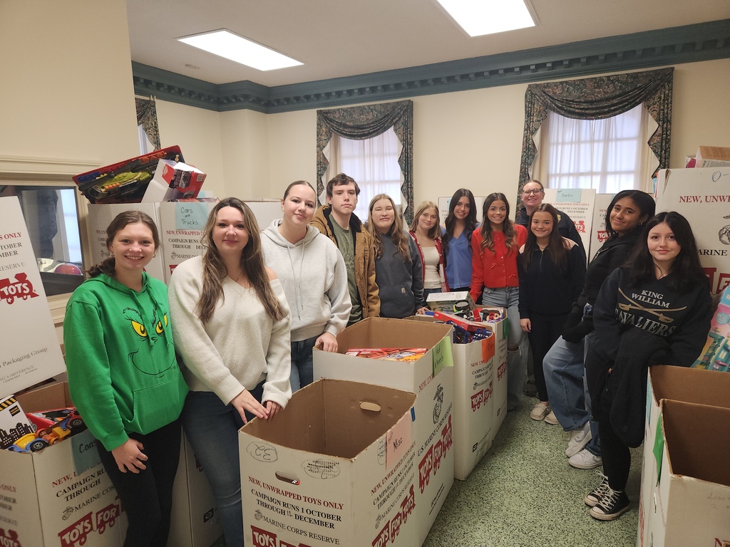 Service Learning STudents helping to sort Toys for Tots