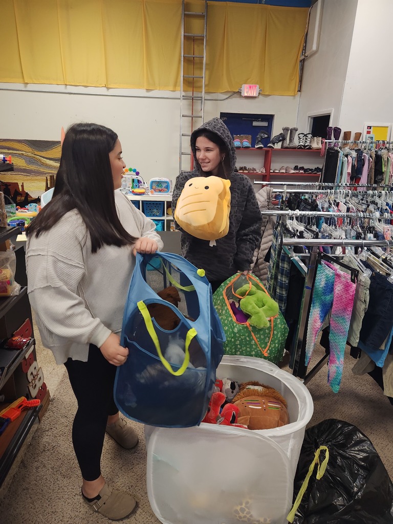 Student helping sort clothes at ARC of Hanover