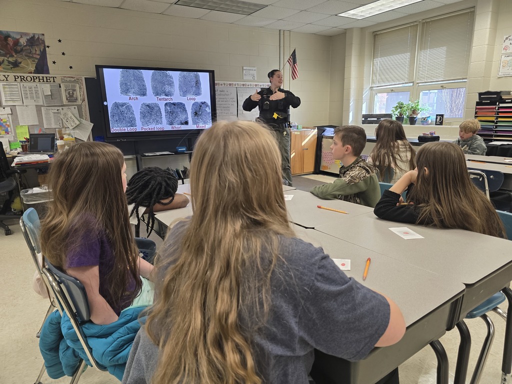 Deputy Anthony talks to a class of students