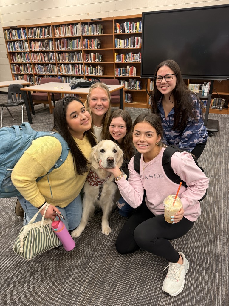 Rudee posing with students
