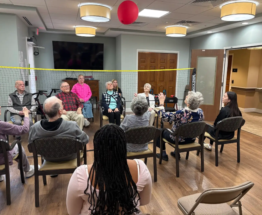 Service Learning students help celebrate Valentines Day playing volleyball with Covenant Woods residents