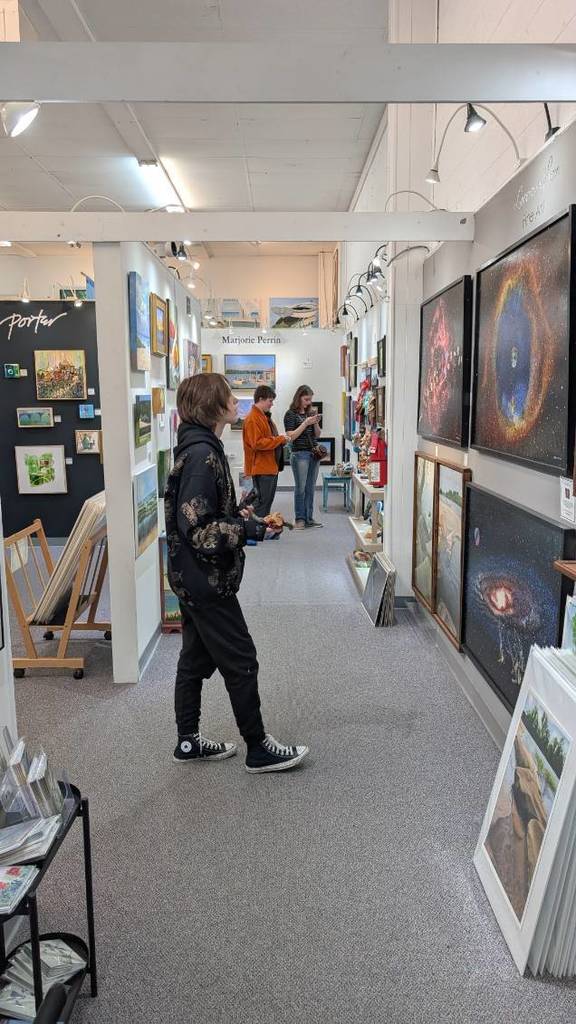Students in front of local art work at Crossroads Art Center