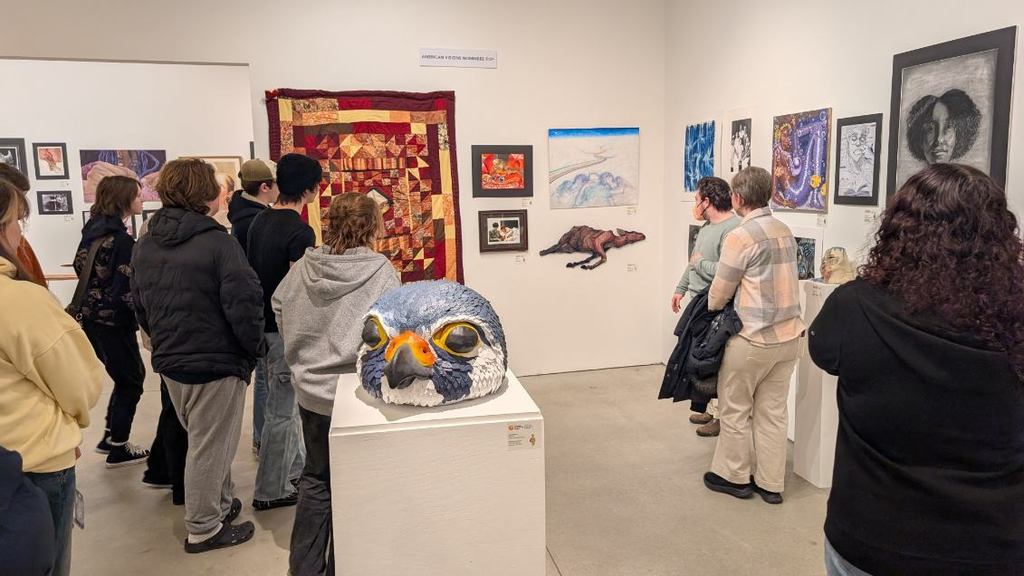 Students looking at the felting work at the Visual Arts Center