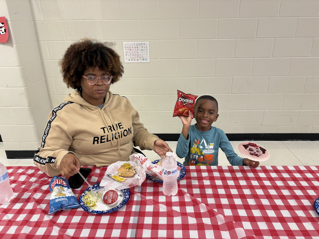 A family eating dinner in the cafeteria