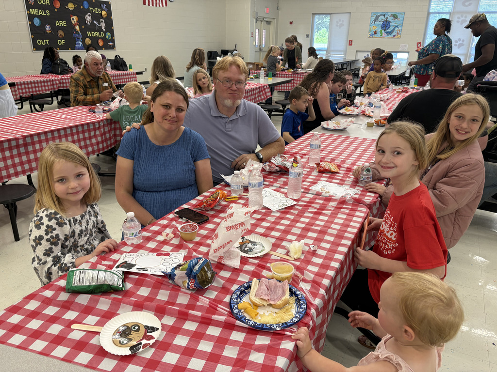 Families eating dinner in the cafeteria