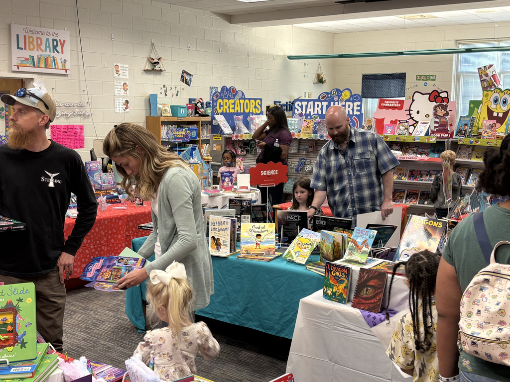 Families exploring the book fair
