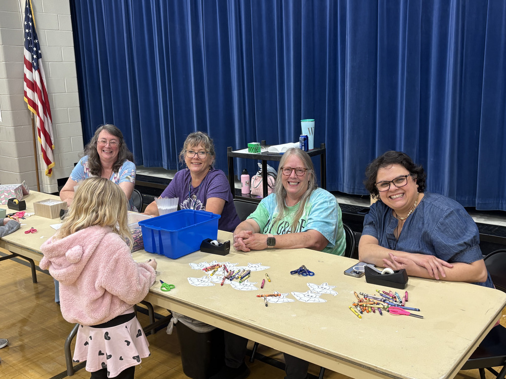 Teachers welcoming families to Family night