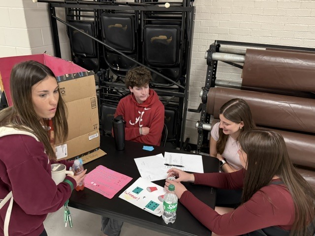 Students playing game of chance carnival game