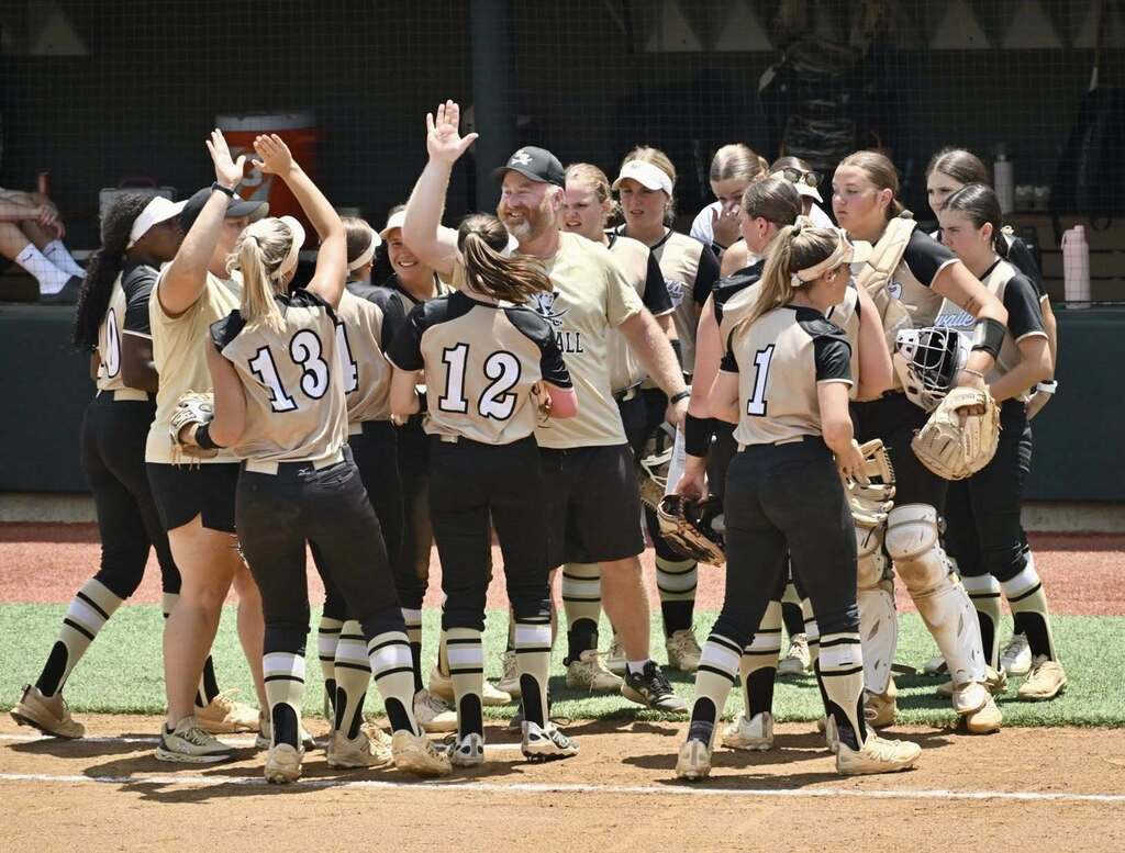 Softball team celebrates their win