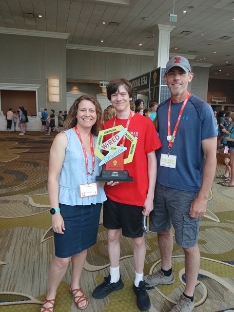 Silas Heinsman with his parents after winning 5th place 