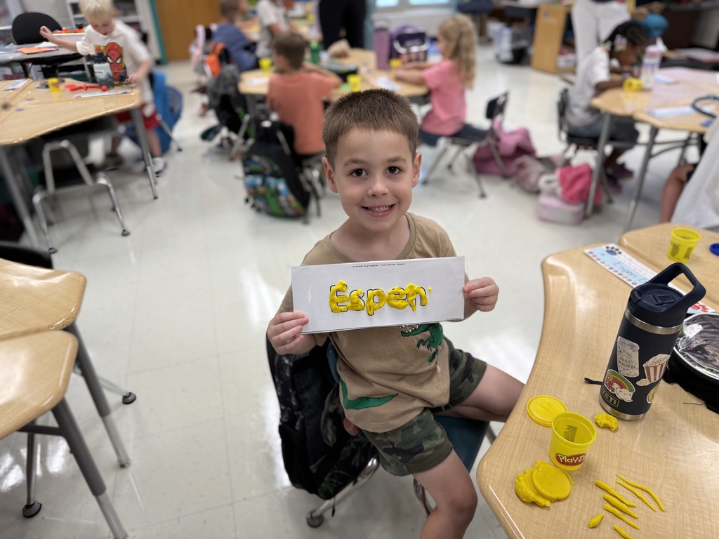 Student showing off their class work.