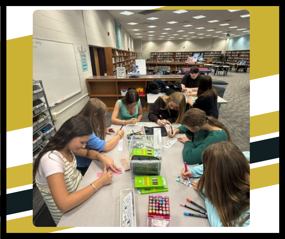 Students designing and coloring bookmarks