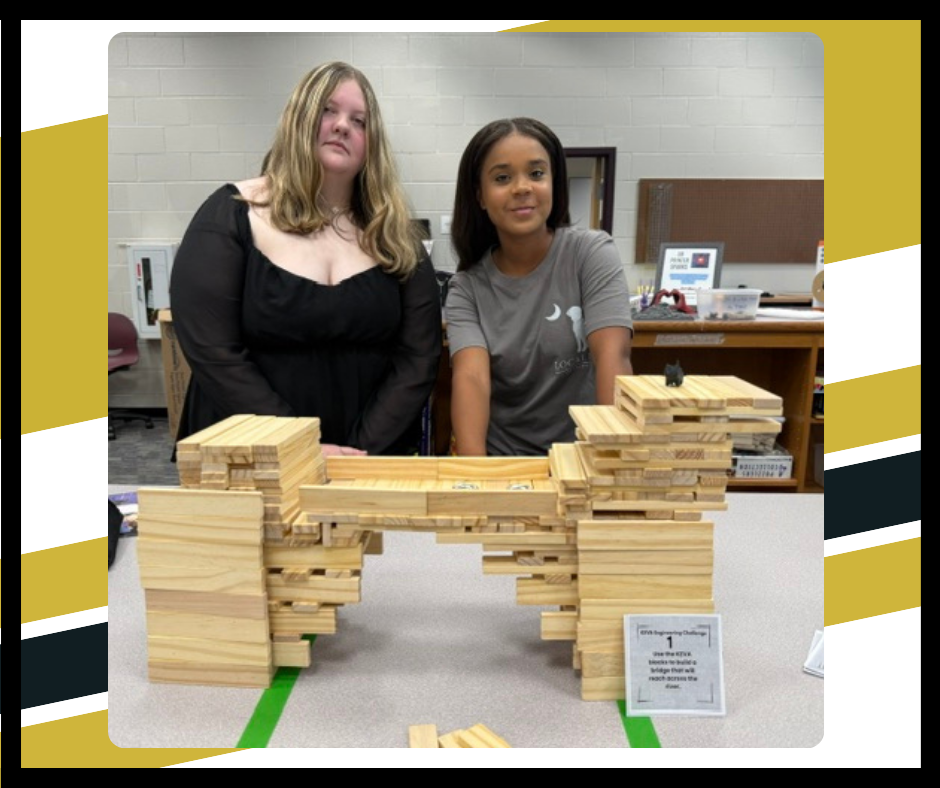 Students building a bridge with Keva blocks