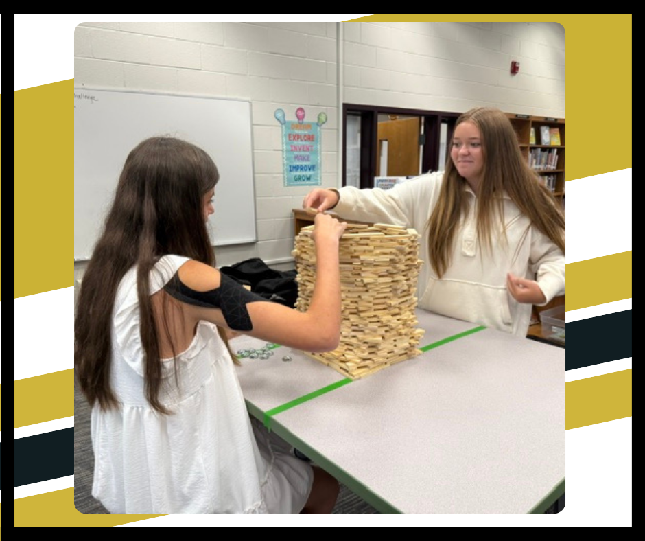 Students building with Keva blocks
