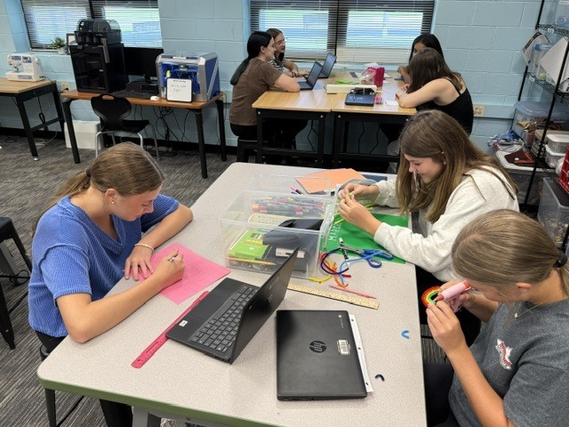 Students designing a game board for Algebra class
