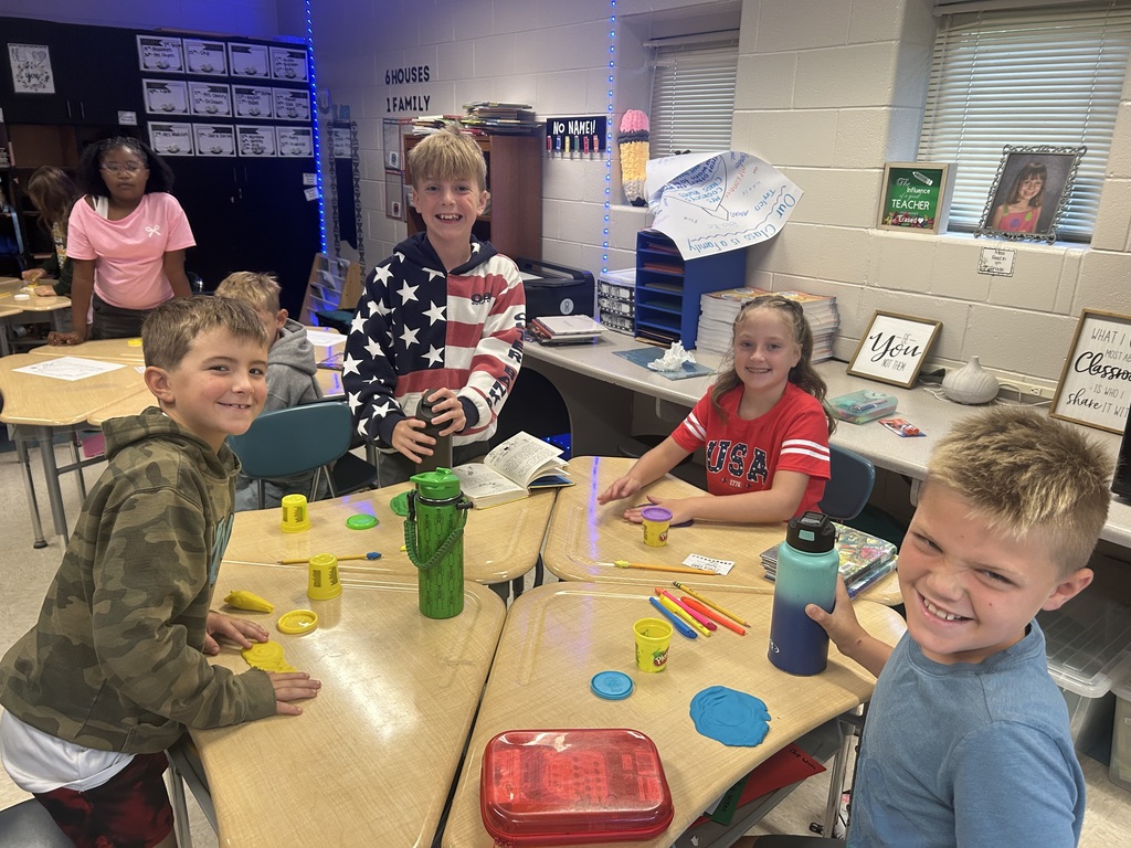 Students creating topography models out of play-doh.
