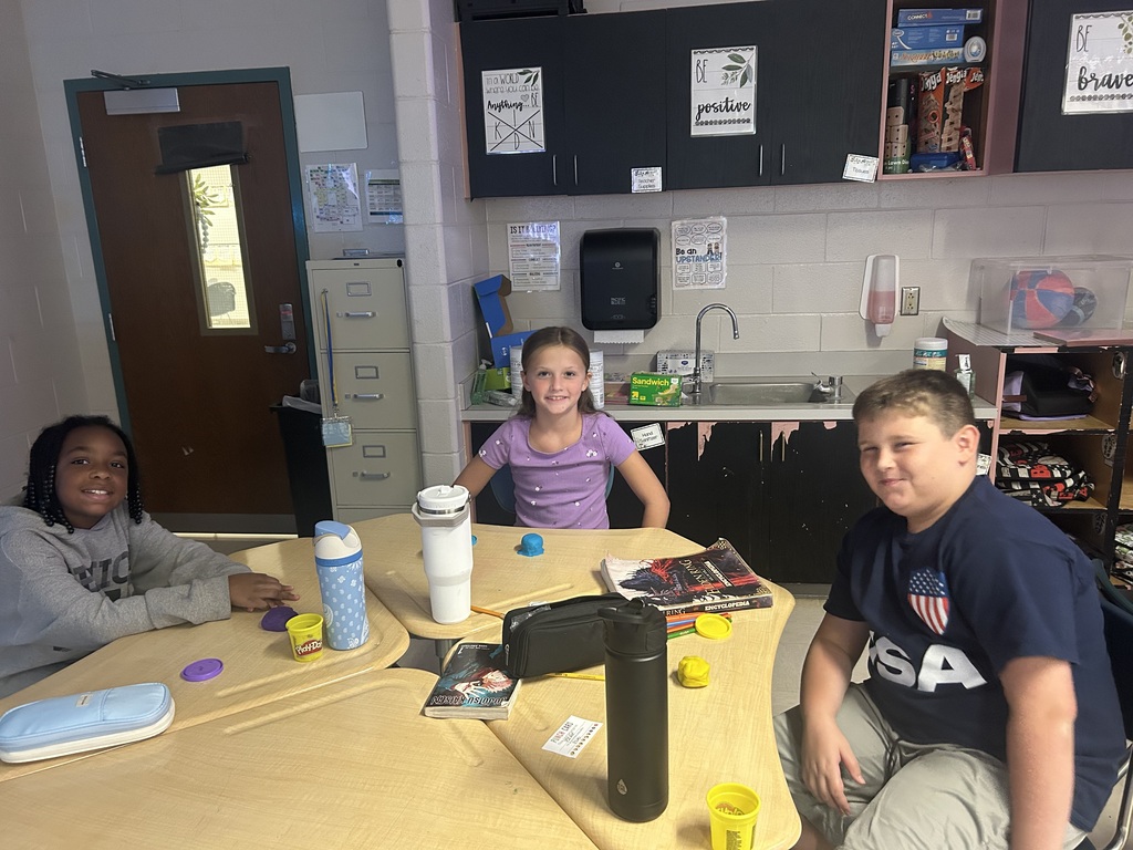 Students creating topography models out of play-doh.