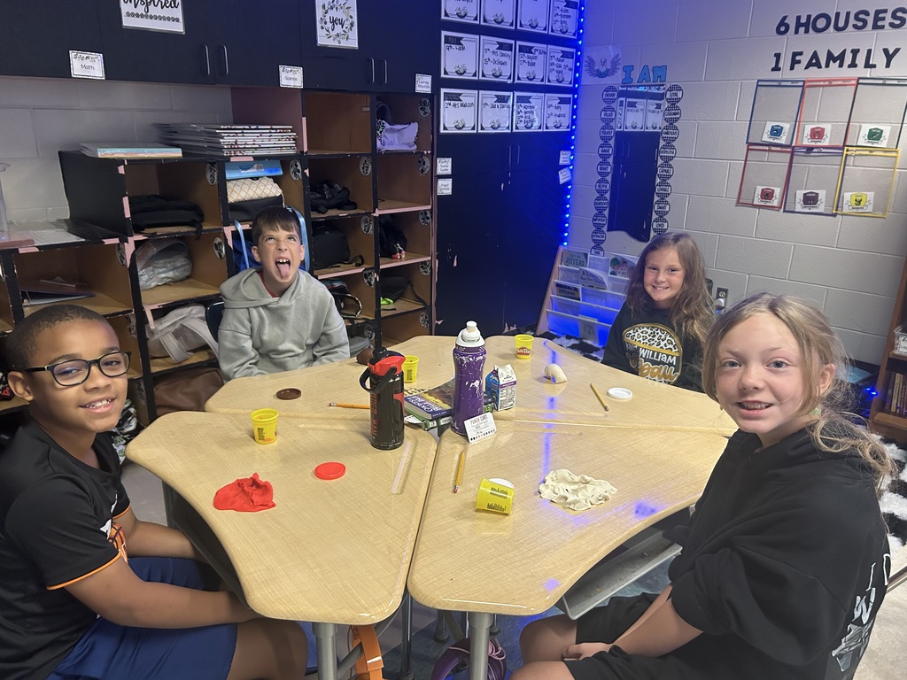 Students creating topography models out of play-doh.