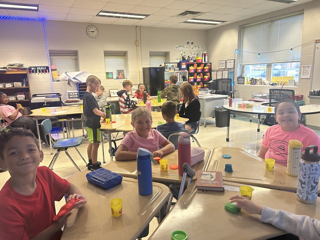 Students creating topography models out of play-doh.