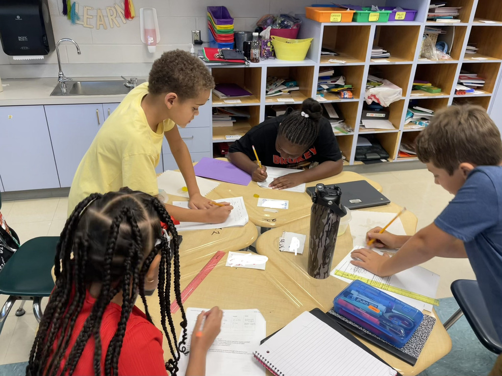 Students completing an experiment in science class.