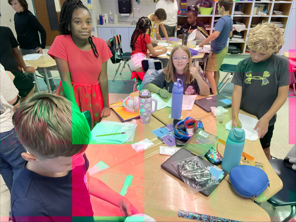 Students completing an experiment in science class.