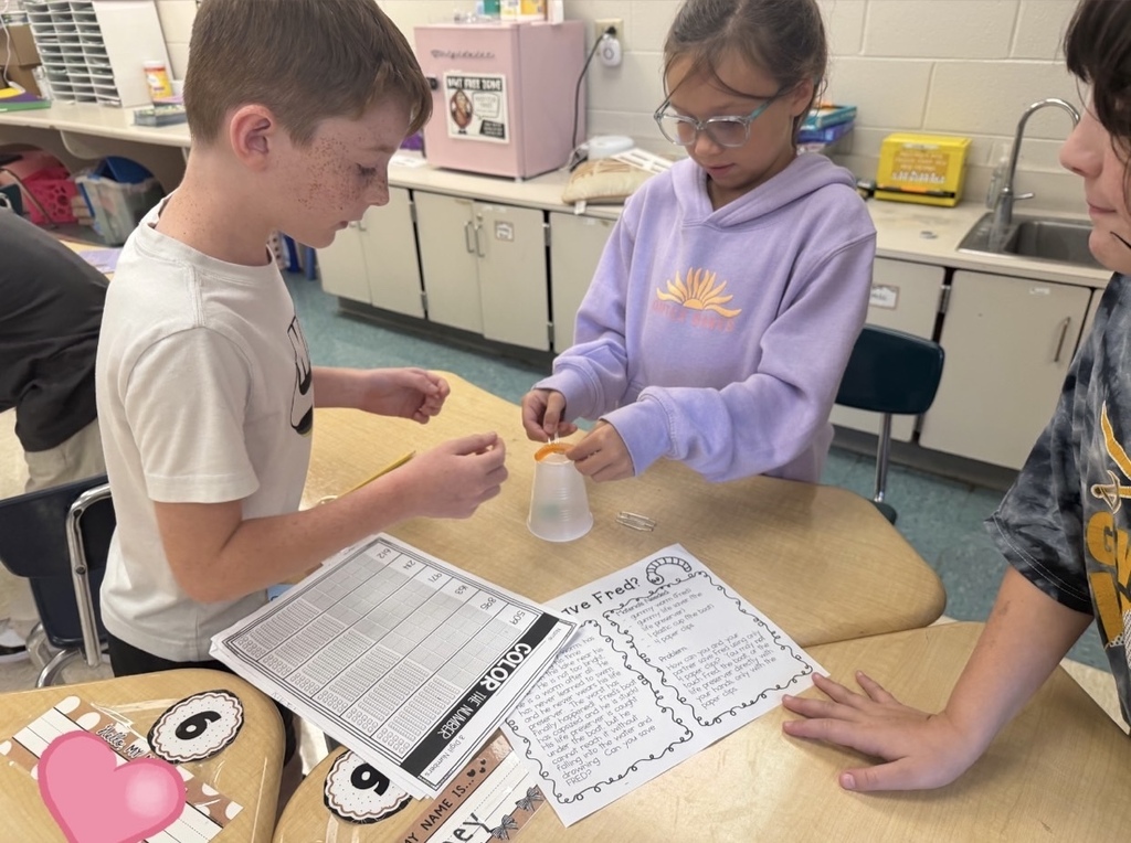 Students "save" their gummy worm using 4 paperclips and a lifesaver.