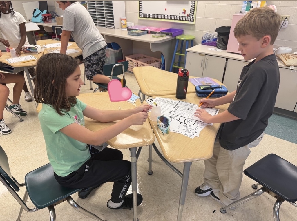 Students "save" their gummy worm using 4 paperclips and a lifesaver.