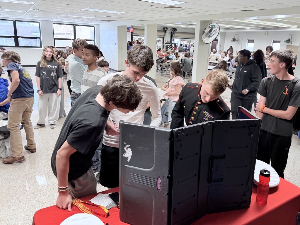 Students talk to Marine Corps recruiters during lunch.