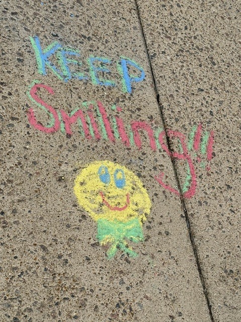  positive messages on the sidewalk - Keep smiling