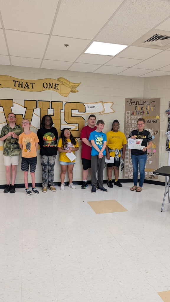 Students giving a card and  our staff that are veterans and former law enforcement
