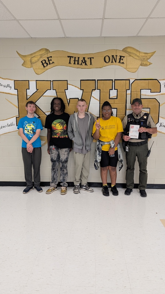 Students giving a card and  our staff that are veterans and law enforcement