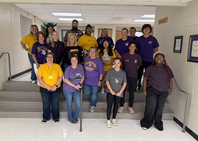 Staff donning their purple and gold 