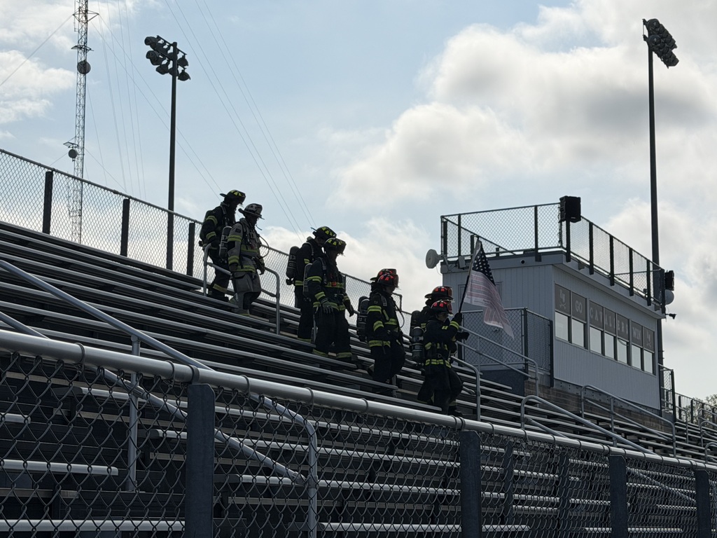 Firefighters and EMS personnel climb stairs to honor and remember those who lost their lives on September 11, 2001. Photo by Mrs. Barrick. 