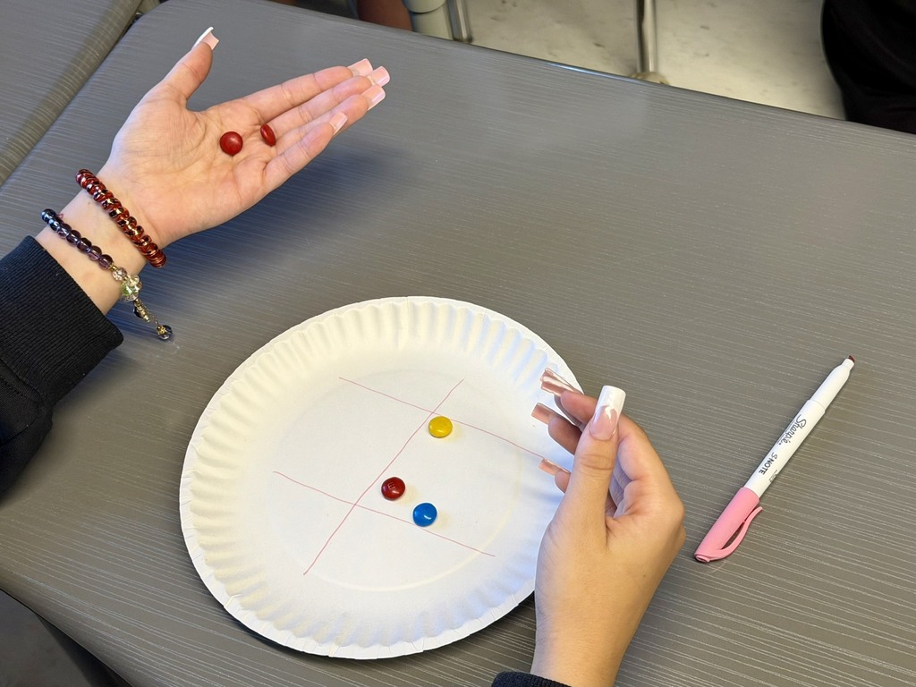 Geometry students play an academic game with M&M's.