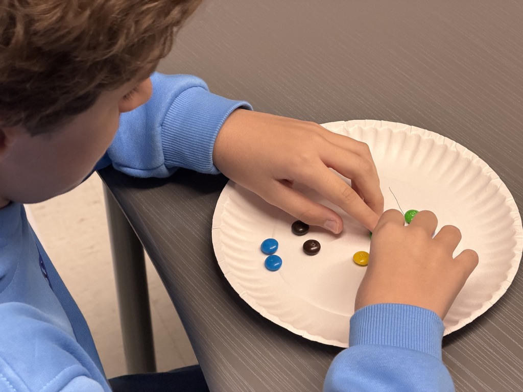 Geometry students play an academic game with M&M's.