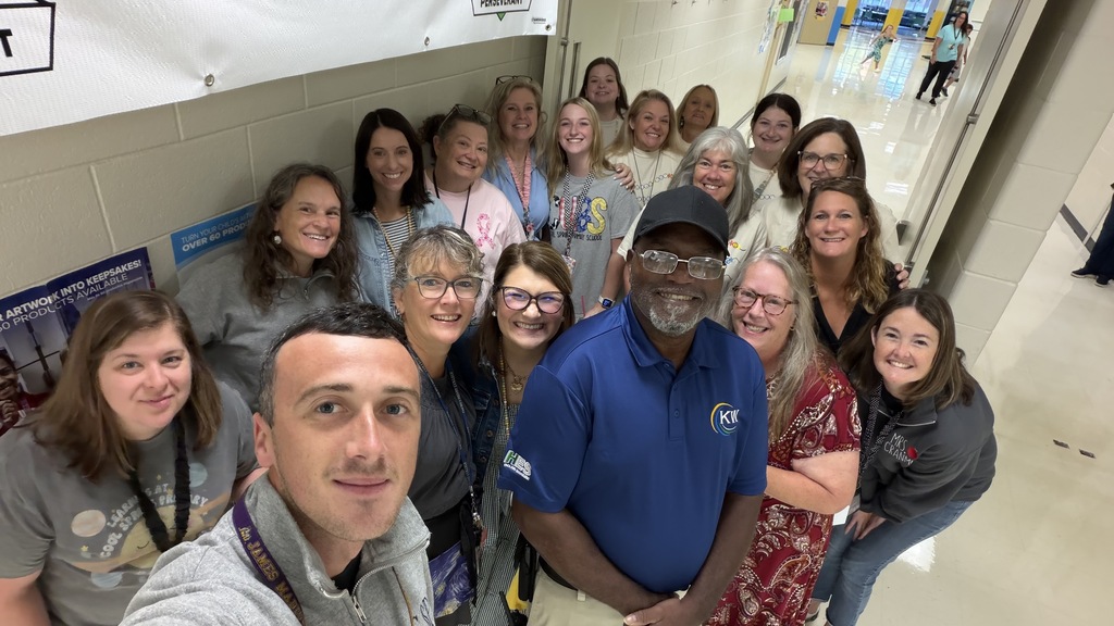 Teacher group photo with custodian.