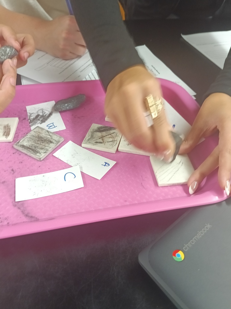 Students conducting a lab on the properties of minerals