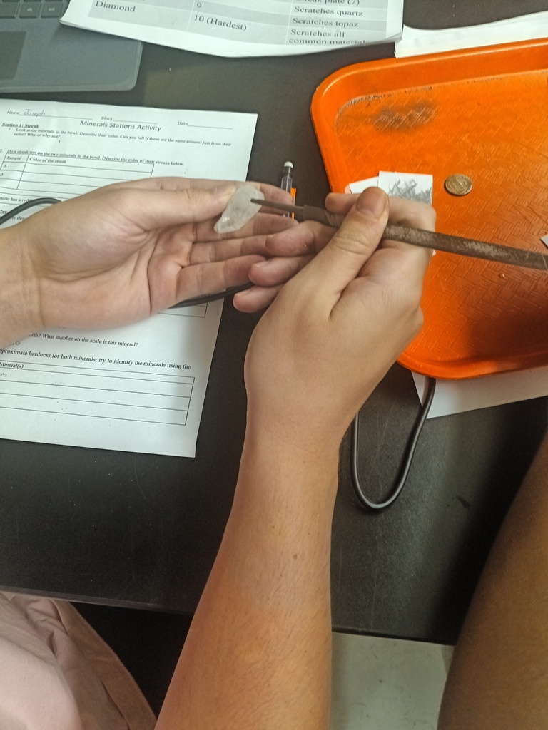 Students conducting a lab on the properties of minerals