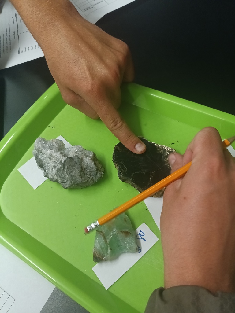 Students conducting a lab on the properties of minerals