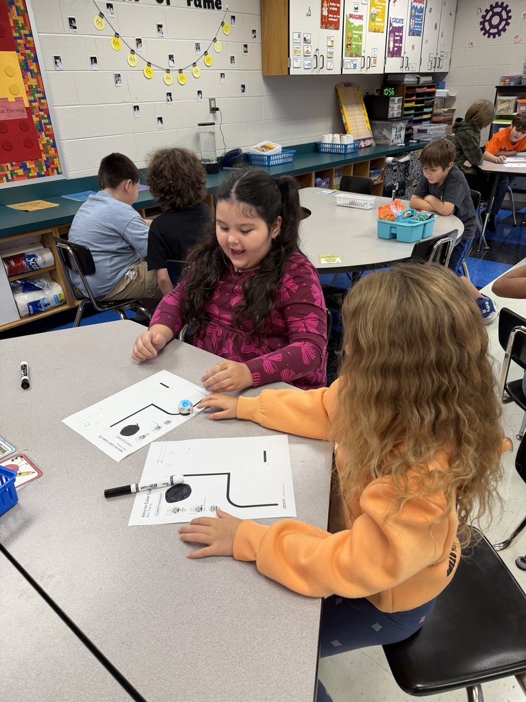 Students coding ozobots during STEM class.