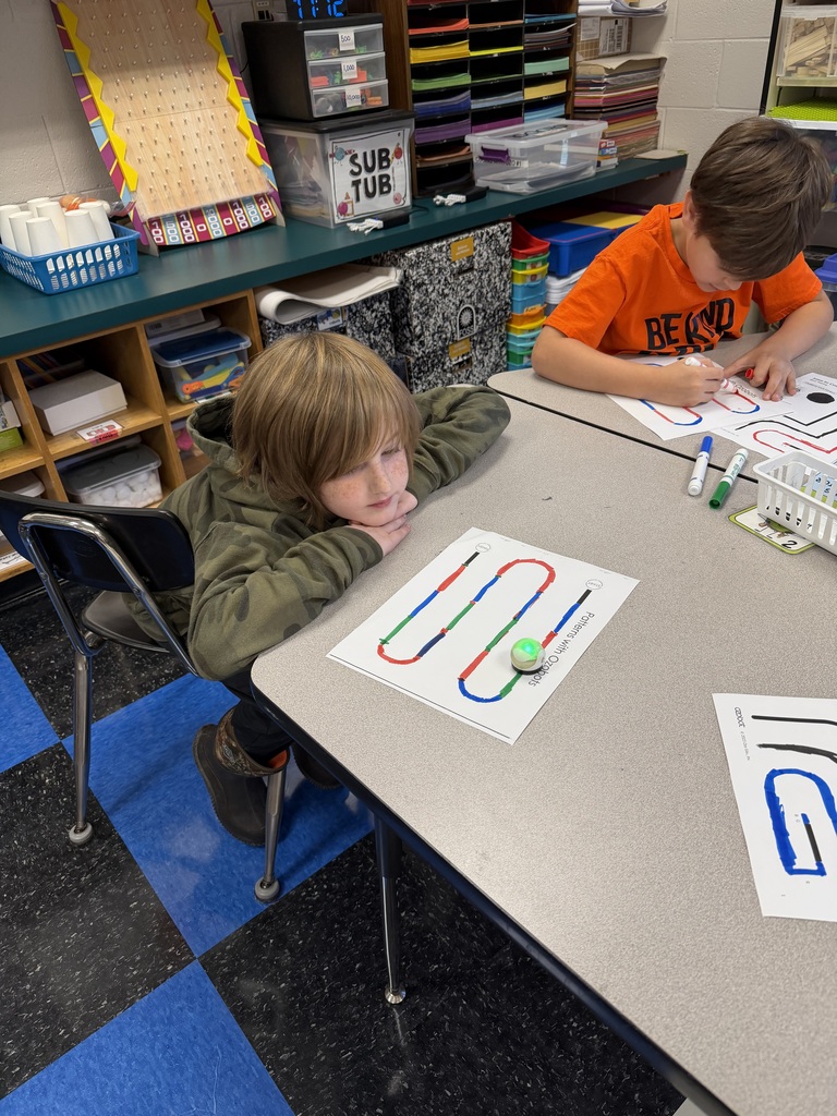 Students coding ozobots during STEM class.