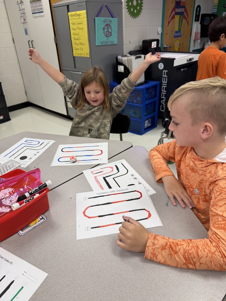 Students coding ozobots during STEM class.