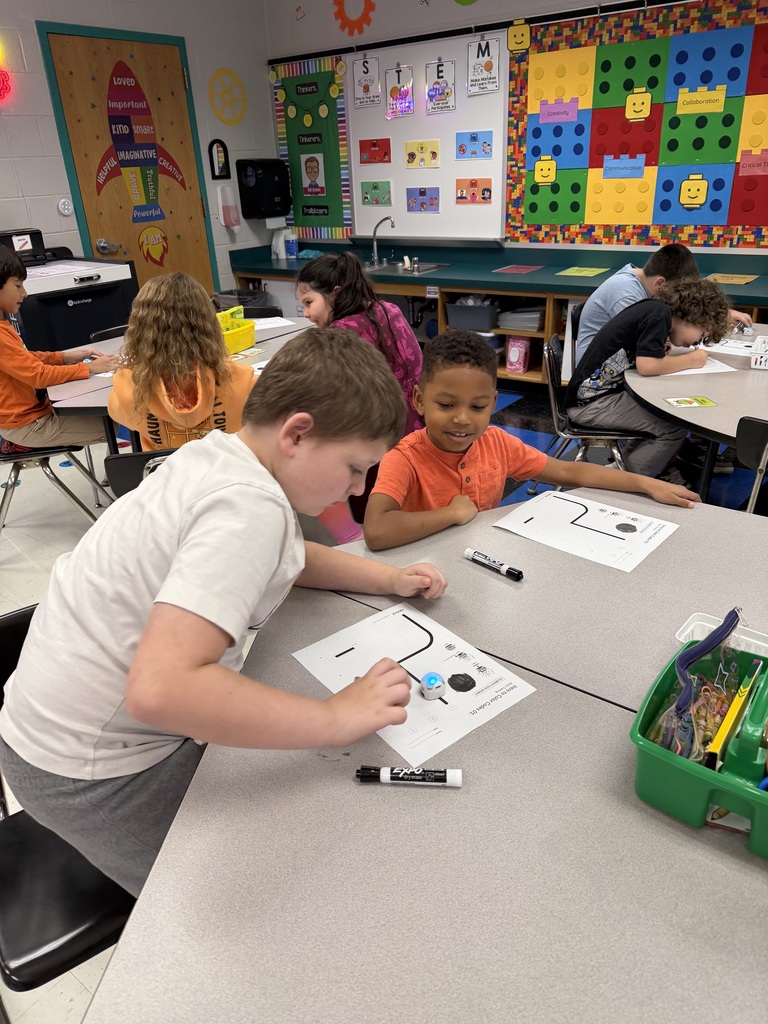 Students coding ozobots during STEM class.