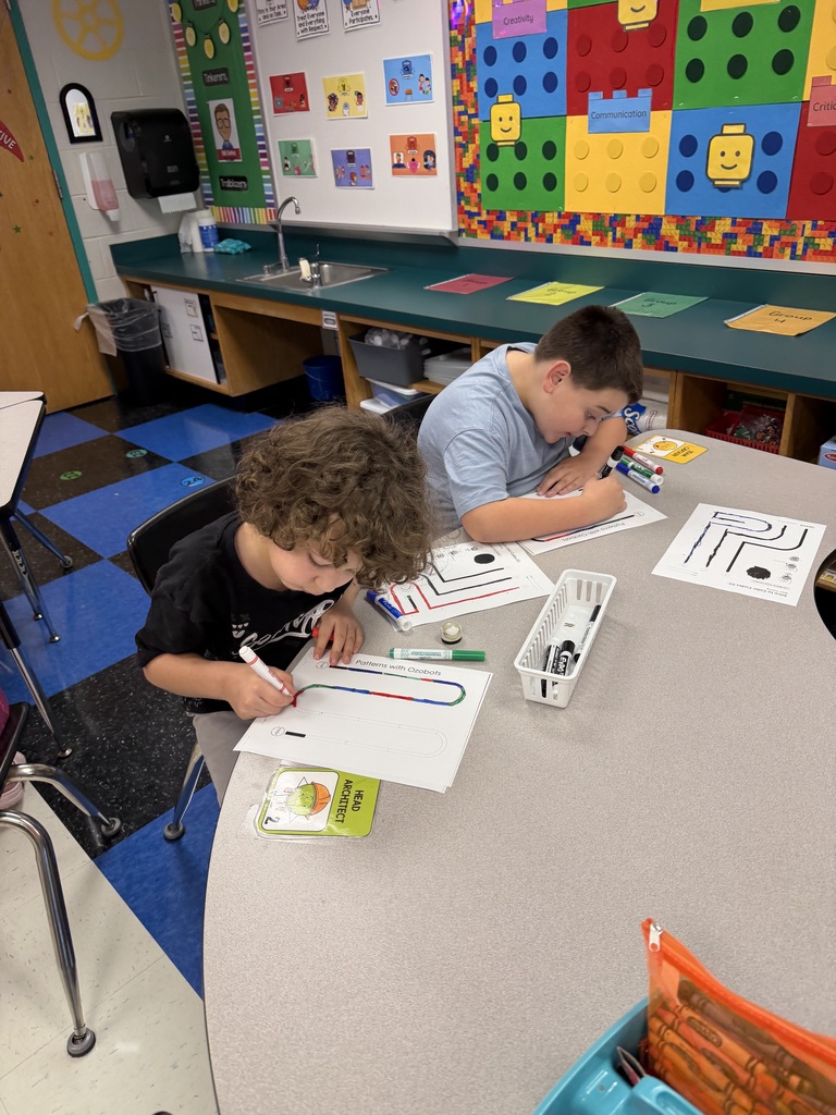 Students coding ozobots during STEM class.