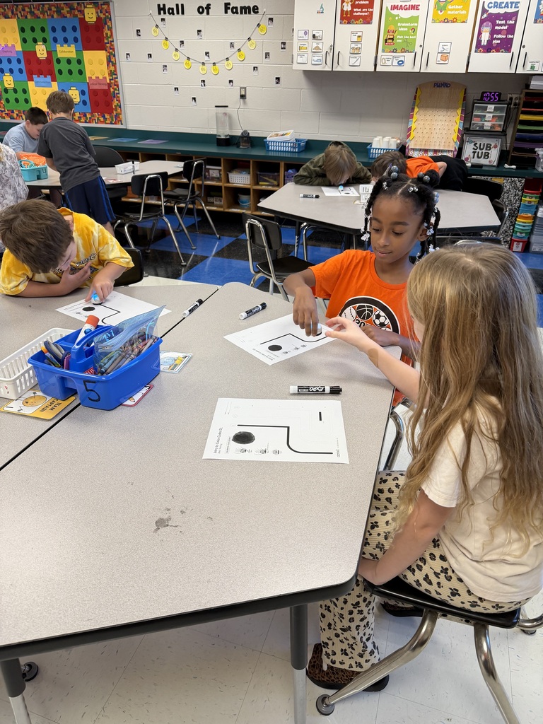 Students coding ozobots during STEM class.