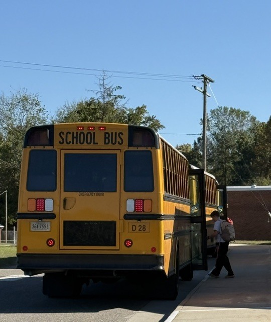 Student getting on a bus
