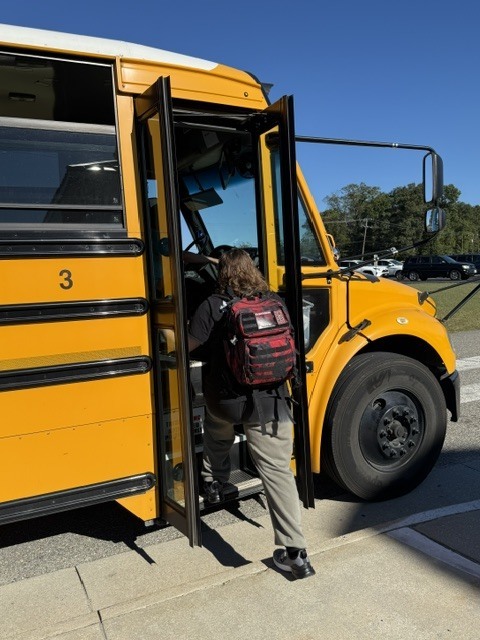 Student getting on a bus