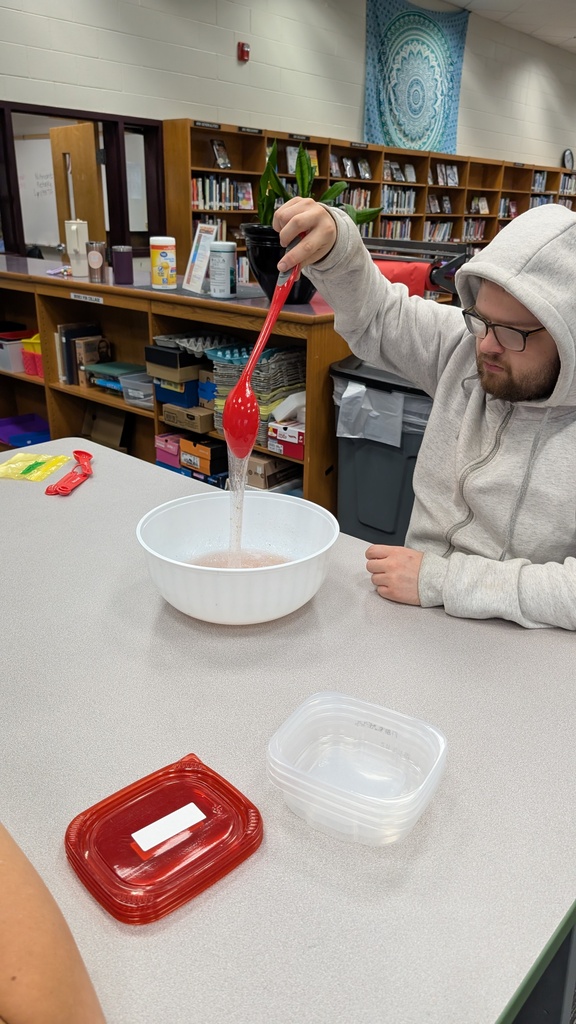 Students stretching slime