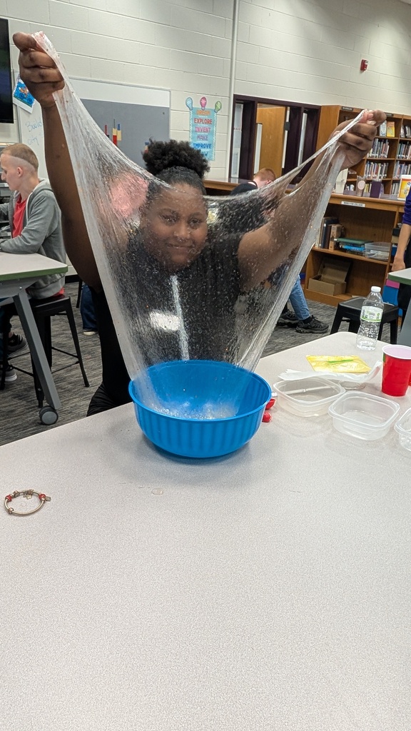 Students stretching slime