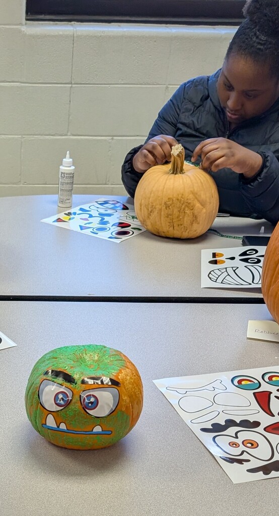 TILT students decorating pumpkins together